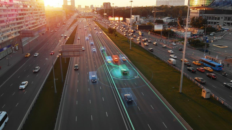 image of busy highway that could have Millions of vehicles equipped with road surface sensing software are monitoring the road network continuously to warn other cars.